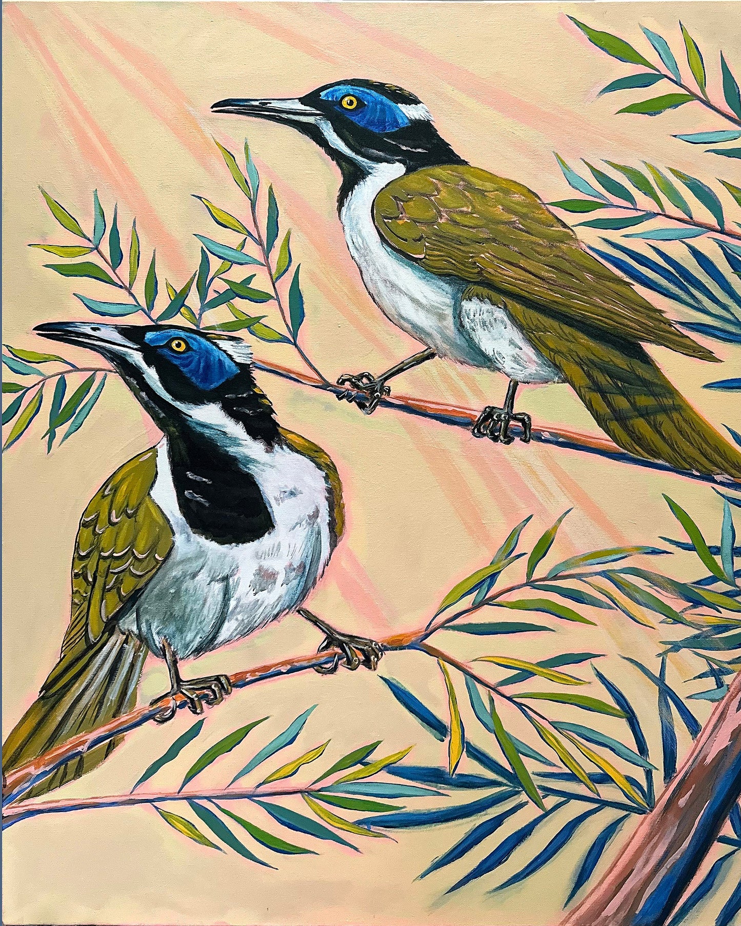 Two birds perched on branches with leaves in the background